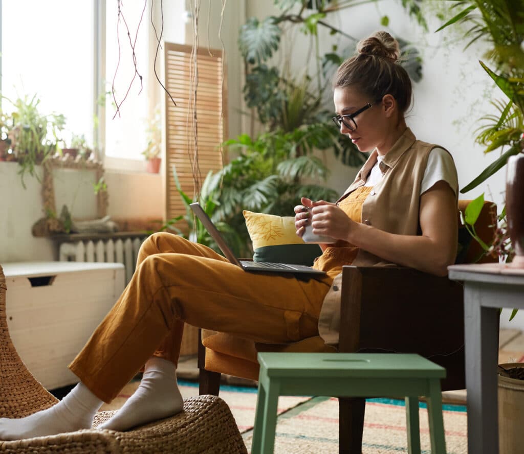 Woman on laptop in house