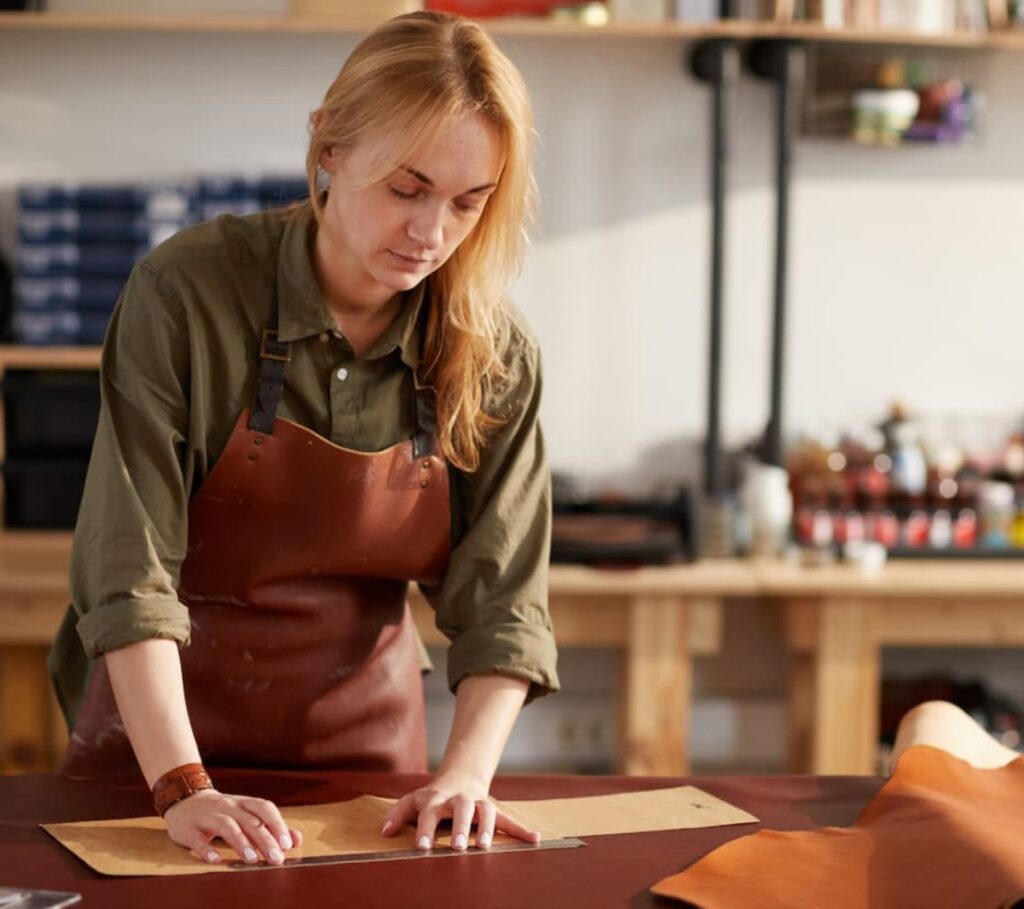 Woman Working in Leather Shop